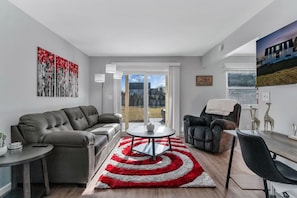 Spacious living room with cozy furniture.