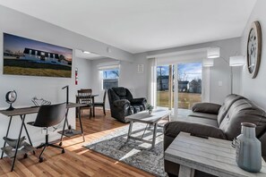 Multifunctional living room space with direct access outside to the hot tub.