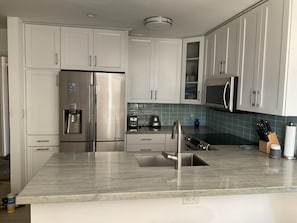 Kitchen with all new appliances, cabinets, marble countertops