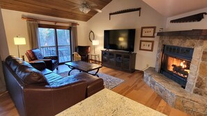 Open concept Living Room with easy start propane fireplace and mountain views.