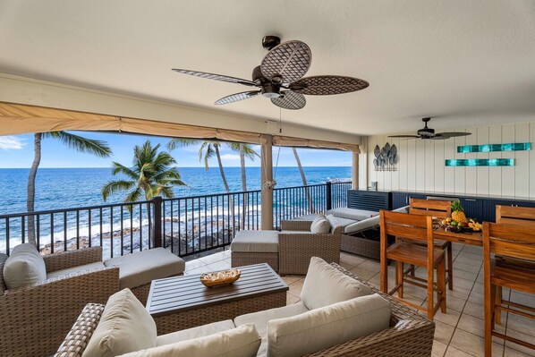 Private oceanfront lanai with plenty of seating and lounging options.