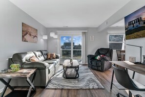 Spacious living room with cozy furniture.