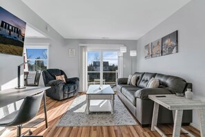 Spacious living room with cozy furniture.