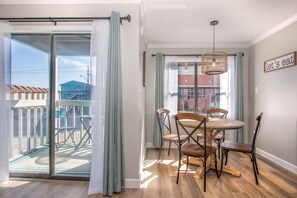 Gather, dine, and make memories in this cozy dining nook, perfect for four. The dining area boasts a chic new chandelier, creating an intimate ambiance for shared meals and laughter.