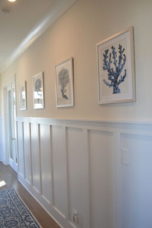 The home contains coastal artwork to set the tone of coastal living.