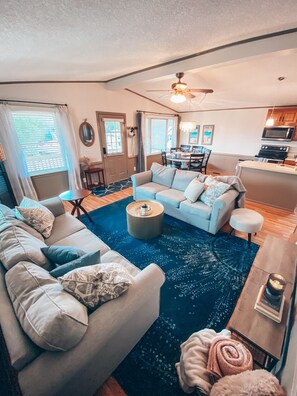 Open floor plan to include kitchen, living room, and dining area. 