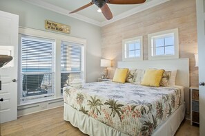 Beach Breeze Primary Bedroom: Experience coastal bliss in this elegant king bedroom, boasting panoramic ocean views that stretch as far as the eye can see, paired with a luxurious ensuite bathroom for a truly indulgent retreat.