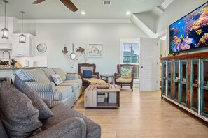 Beach Breeze Living Area: Crafted with the utmost attention to detail, this expansive space seamlessly blends elegance with functionality, creating an atmosphere of refined comfort and style.