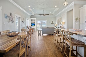 Pineapple Paradise Kitchen: Entertain guests in style in this luxurious kitchen, featuring a granite island with bar seating, perfect for serving hors d'oeuvres and cocktails while enjoying the coastal breeze.