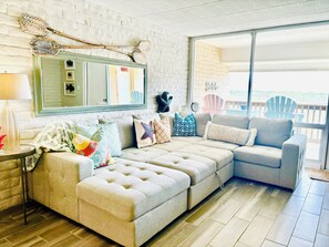 Living Room w/views of the Ocean.  Enjoy listening to the waves on the balcony!