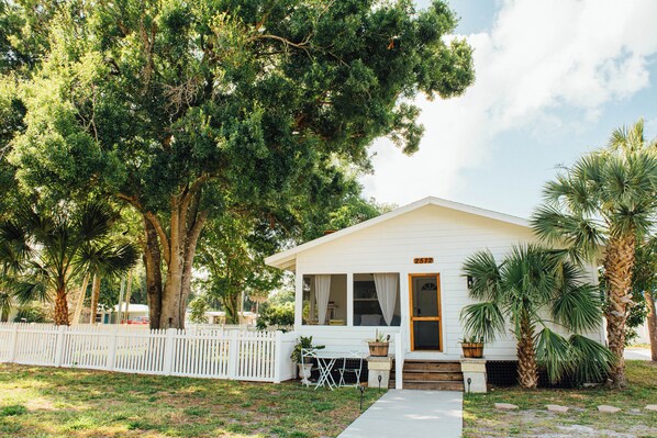 This 100-year-old classic Florida bungalow has been newly renovated into a stylish, modern & comfy home featuring a new kitchen, bathrooms, deck, fenced yard (pets welcome!), fire pit & outdoor shower. 