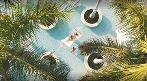 Swing into Serenity: Relax beneath the swaying palms in our Hammocks at Four Seasons Hotel Miami.