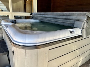 Outdoor sheltered hot tub 
