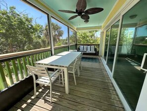 Screened front porch with large glass slider opening from family room 