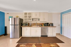 Kitchenette includes refrigerator, microwave, dishwasher, sink, coffee maker