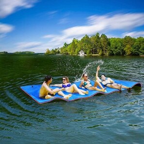 Lake water floating pad located on the dock. Stock picture, this is not us.