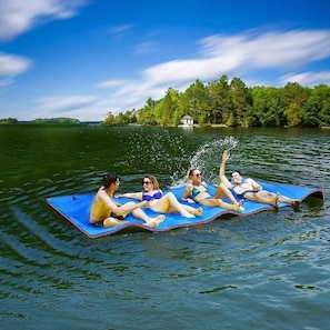Lake water floating pad located on the dock. Stock picture, this is not us.