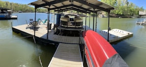Boat dock with 2 jet ski slips, 2 kayaks and a canoe. Our boat stays under cover