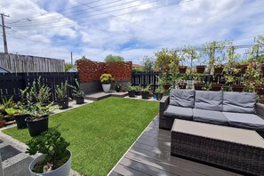 Outdoor seating at front of unit