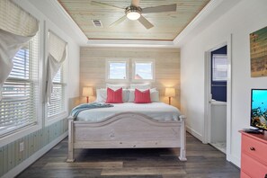 One Love Primary Bedroom 1: A sanctuary of tranquility featuring dual vanities and a spacious layout, promising a haven of comfort and style. 
