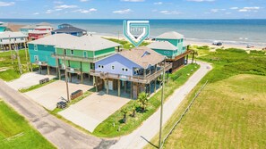 One Love Exterior: Views are endless from the upper deck. Can you feel the coastal breeze and salt air? 