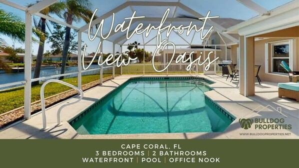 Outdoor pool with seating area, BBQ station, and waterfront views welcome you!