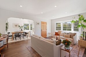 Living room and dining room with bright open windows
