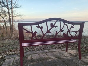 Bird bench on lake cliff