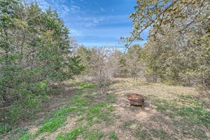 Gather around the fire pit on this 15 acre property