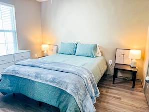 Snuggle into this comfortable bed, featuring a queen bed dressed in linen