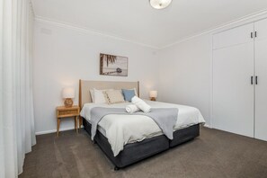 Bedroom one - with king size bed and ample storage.