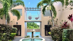 Our elegantly manicured courtyard is welcoming to guests as well as several species of birds and butterflies. 
