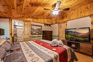 The master bedroom has a comfortable mattress, large Smart TV, and attached full bathroom.