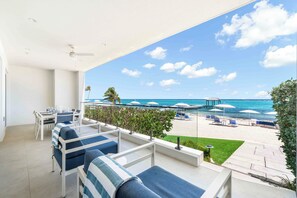 Furnished private veranda with walkout access to the beach!
