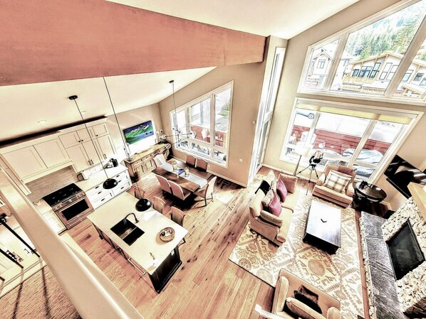 Looking down from 3rd floor onto living room, kitchen, dining and front deck.