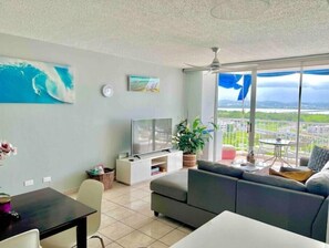 Living Room with Smart TV and Balcony