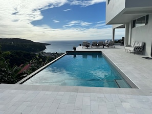 Blue Waters Pool with Sea and Mountain View