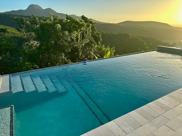 Blue Waters Pool with Sea and Mountain View