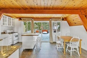 Bathed in natural light, our A-Frame kitchen beckons with its modern amenities and cozy atmosphere