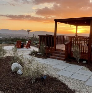 Stunning private views from this Hilltop Hideaway fire pit / deck area.