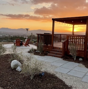 Stunning private views from this Hilltop Hideaway fire pit / deck area.