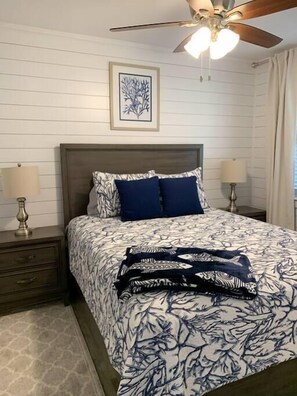 Cozy bedroom featuring a comfortable queen-size bed for a restful night's sleep.