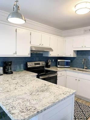 Fully equipped kitchen with stainless steel appliances and all the essentials for cooking an amazing meal!