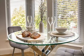 Dining area in the bay window to unwind and watch the world go by.