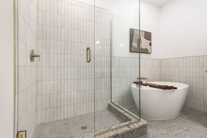 Bathroom 1. Soak and savor with Hollyhock custom shampoo and body wash. Towels are of course, provided. So are bath salts!