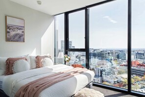 The master bedroom with an amazing view over the city.