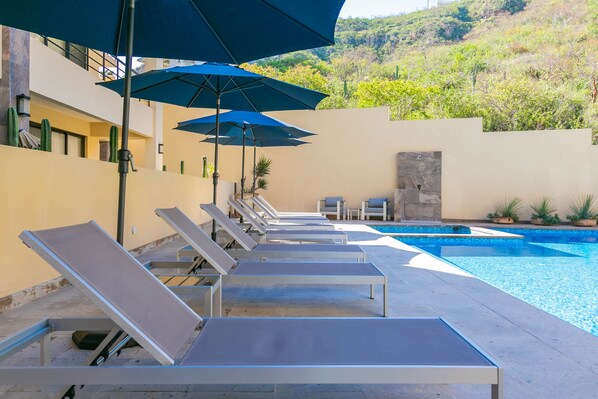 Lounge Chairs and Umbrellas by the Pool
