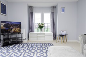 Bright and spacious living area with comfortable seating, perfect for relaxation or socializing.