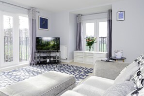 Inviting living space featuring modern decor, ideal for unwinding after a day of exploring.