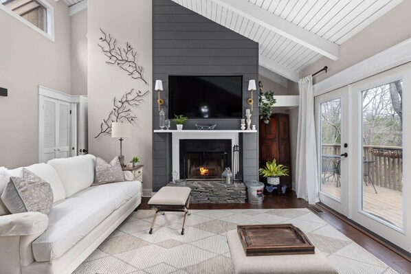 Living Room: Bask in mountain views by the fireplace and unwind in this stylish, airy retreat!